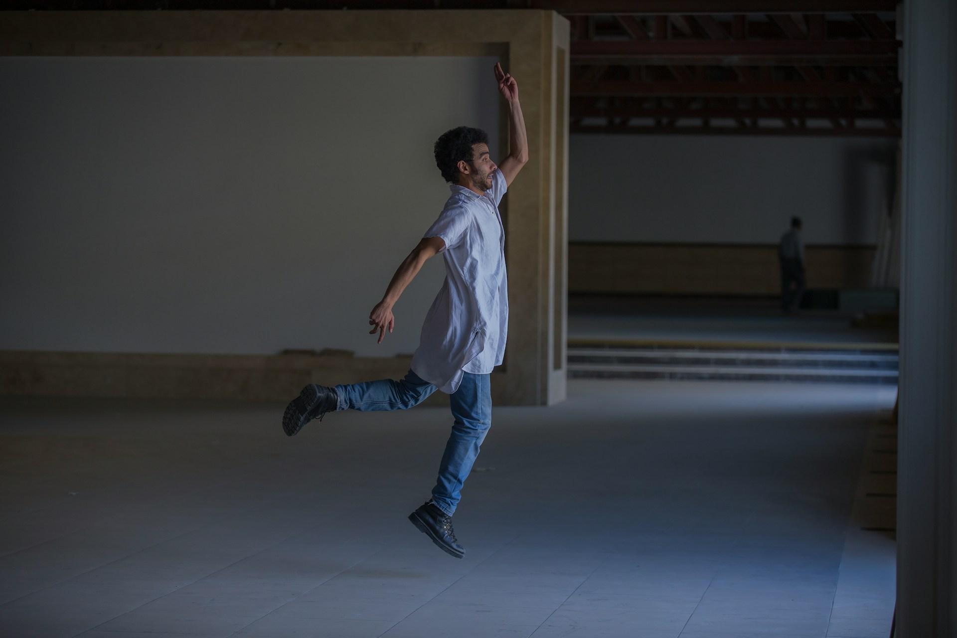 A person leaping mid-air against an open sky, representing Common Ground's approach to driving change